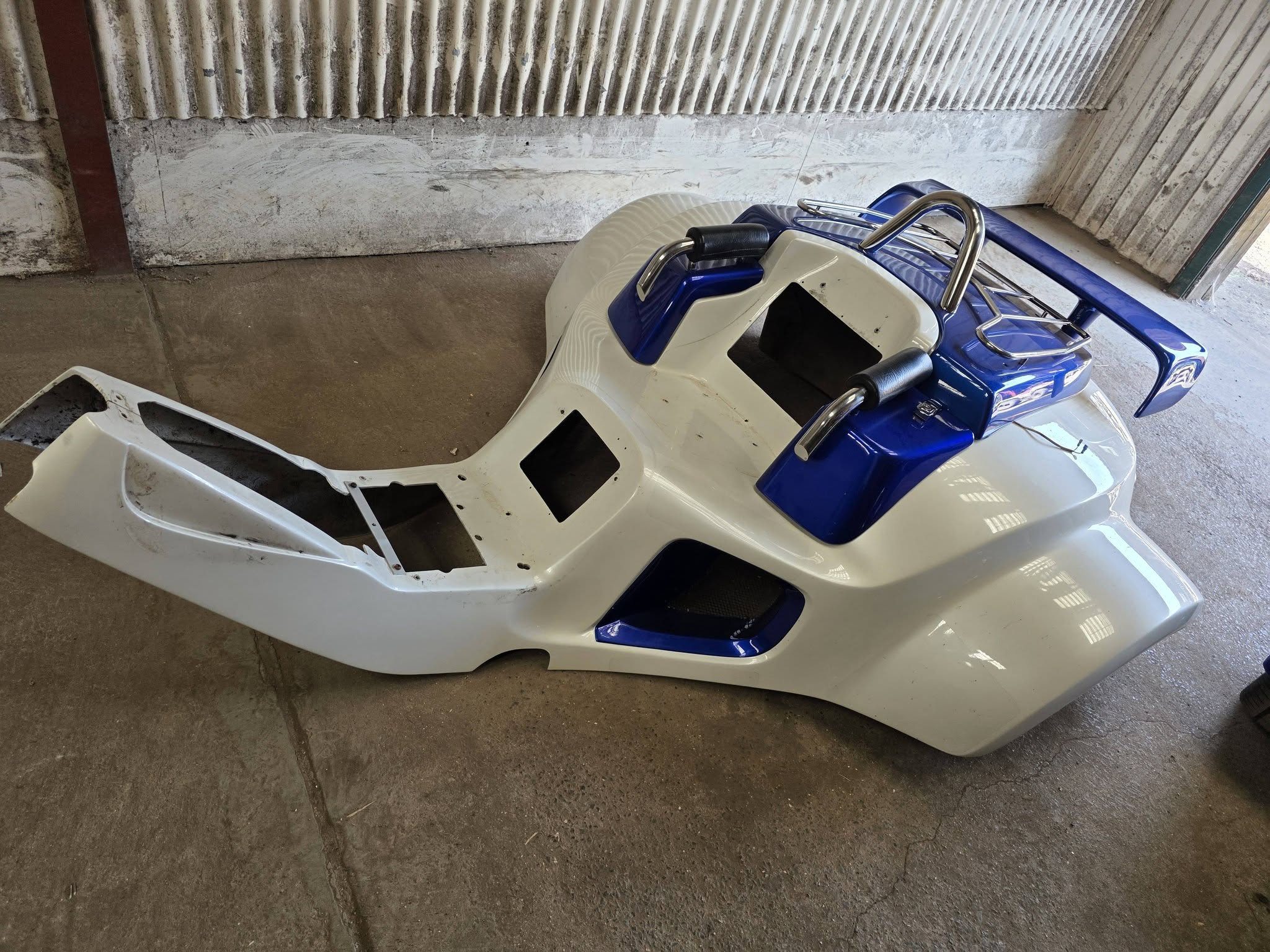 Blue and white trike bodywork removed from a custom project