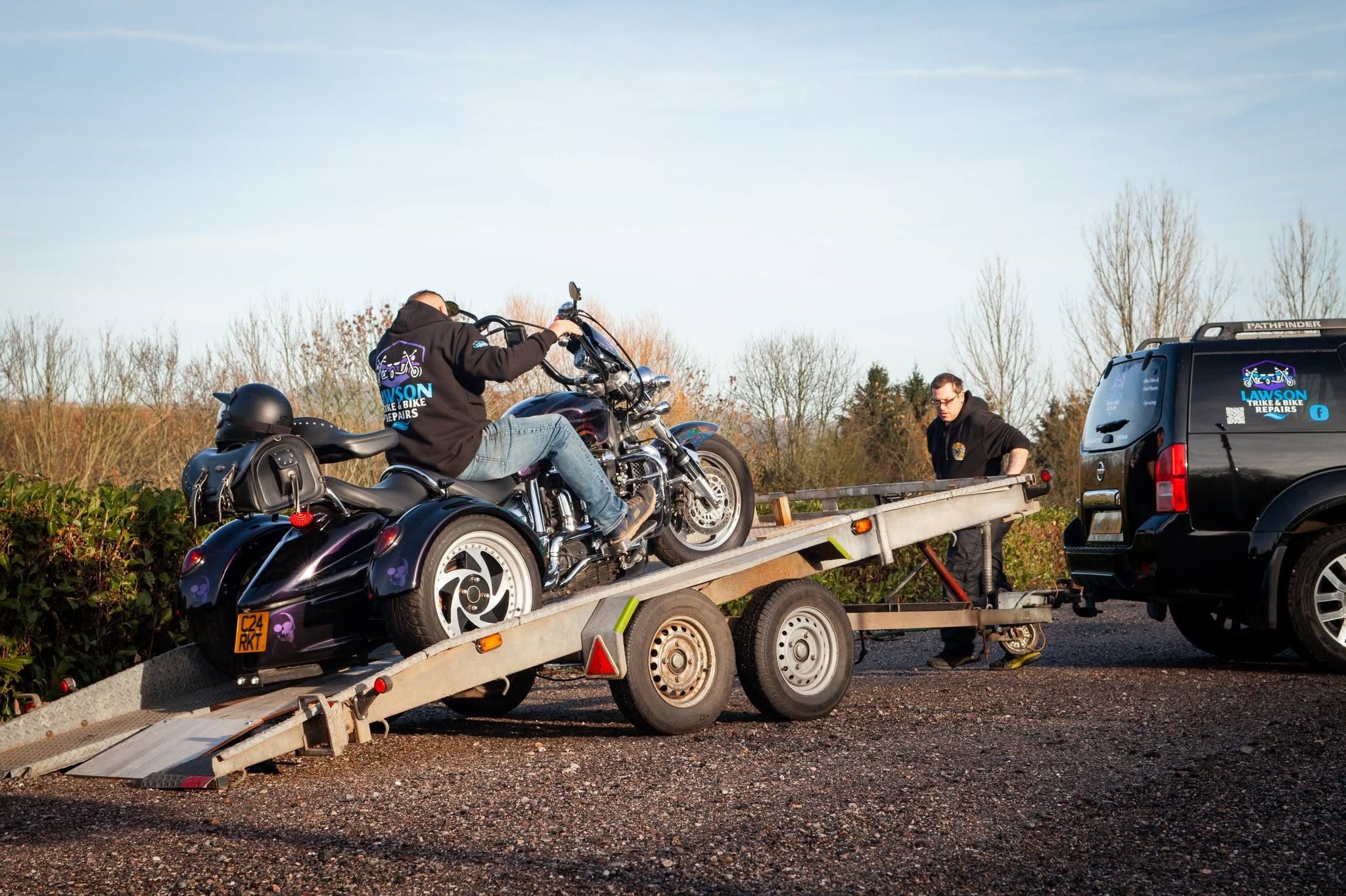A trike being loaded onto the Lawson Repairs trailer